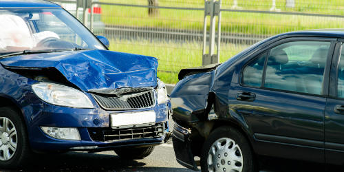 Car accident with a blue and a black car