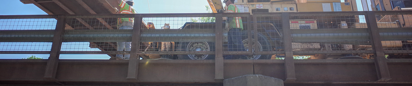 road repair crew completing bridge retrofit 